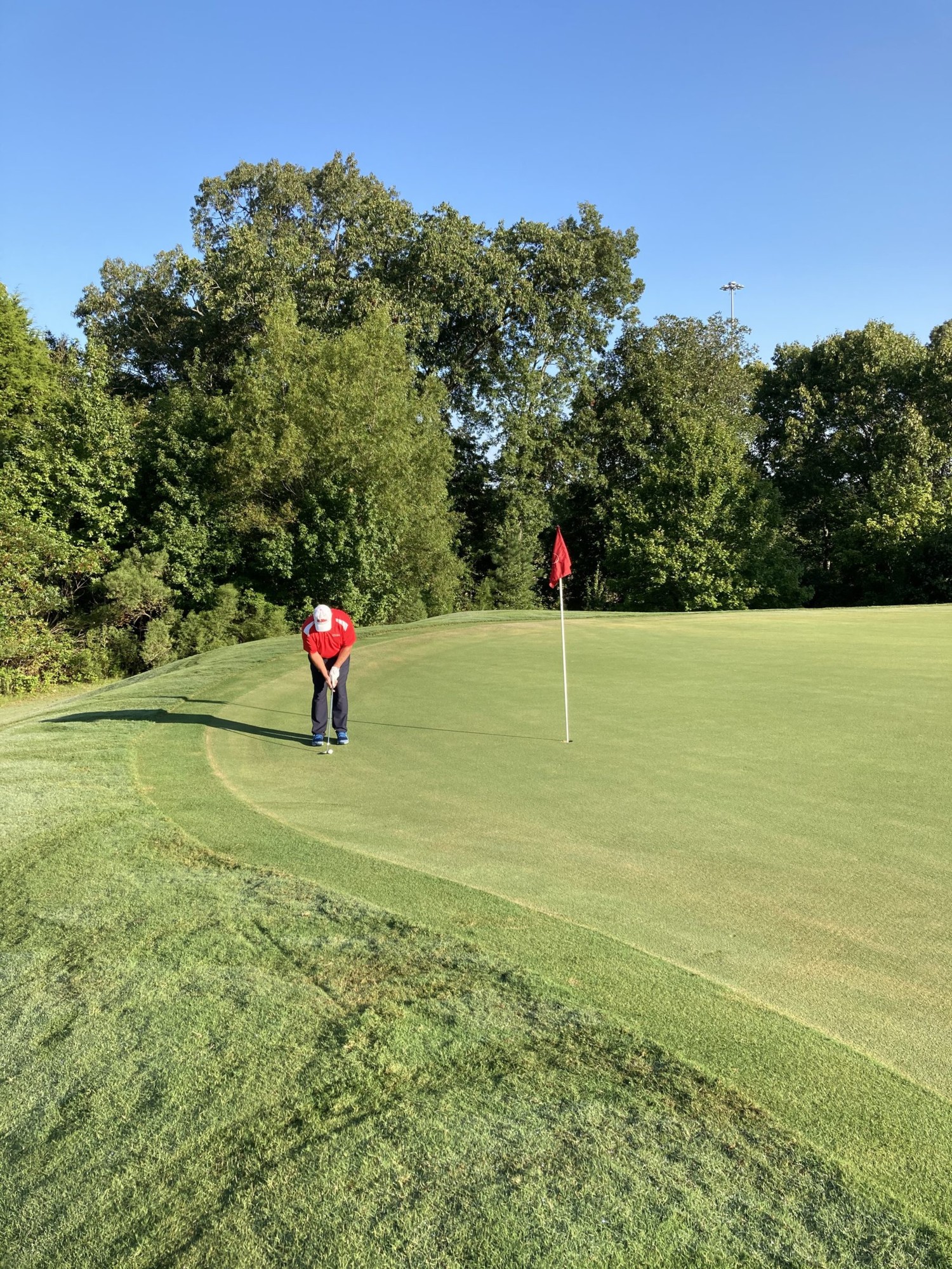 Player on the green at the Country Club of Oxford